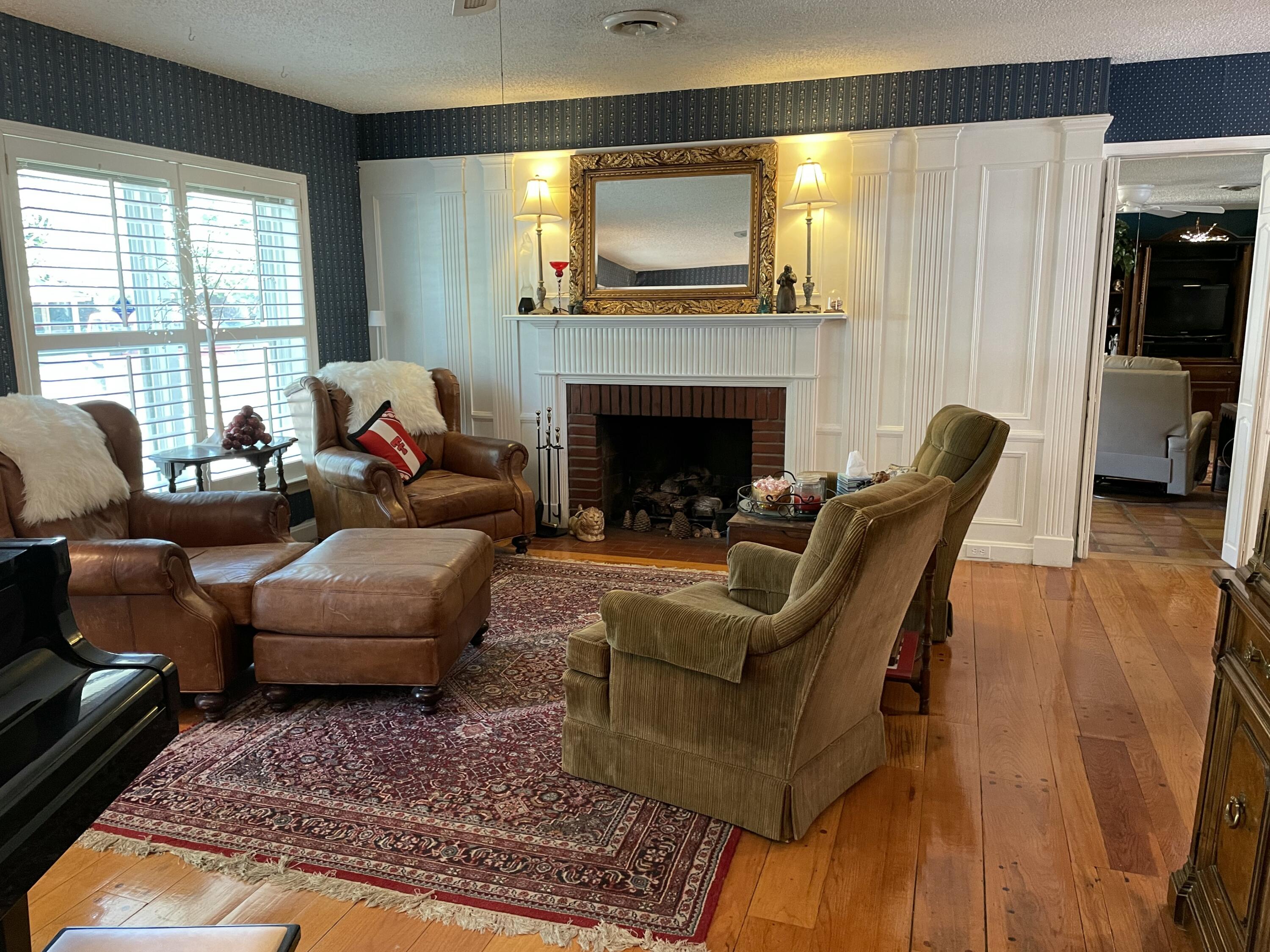 3206 21st Street Lubbock, TX 79410 - Photo 31 of 70 a living room with furniture and a fireplace