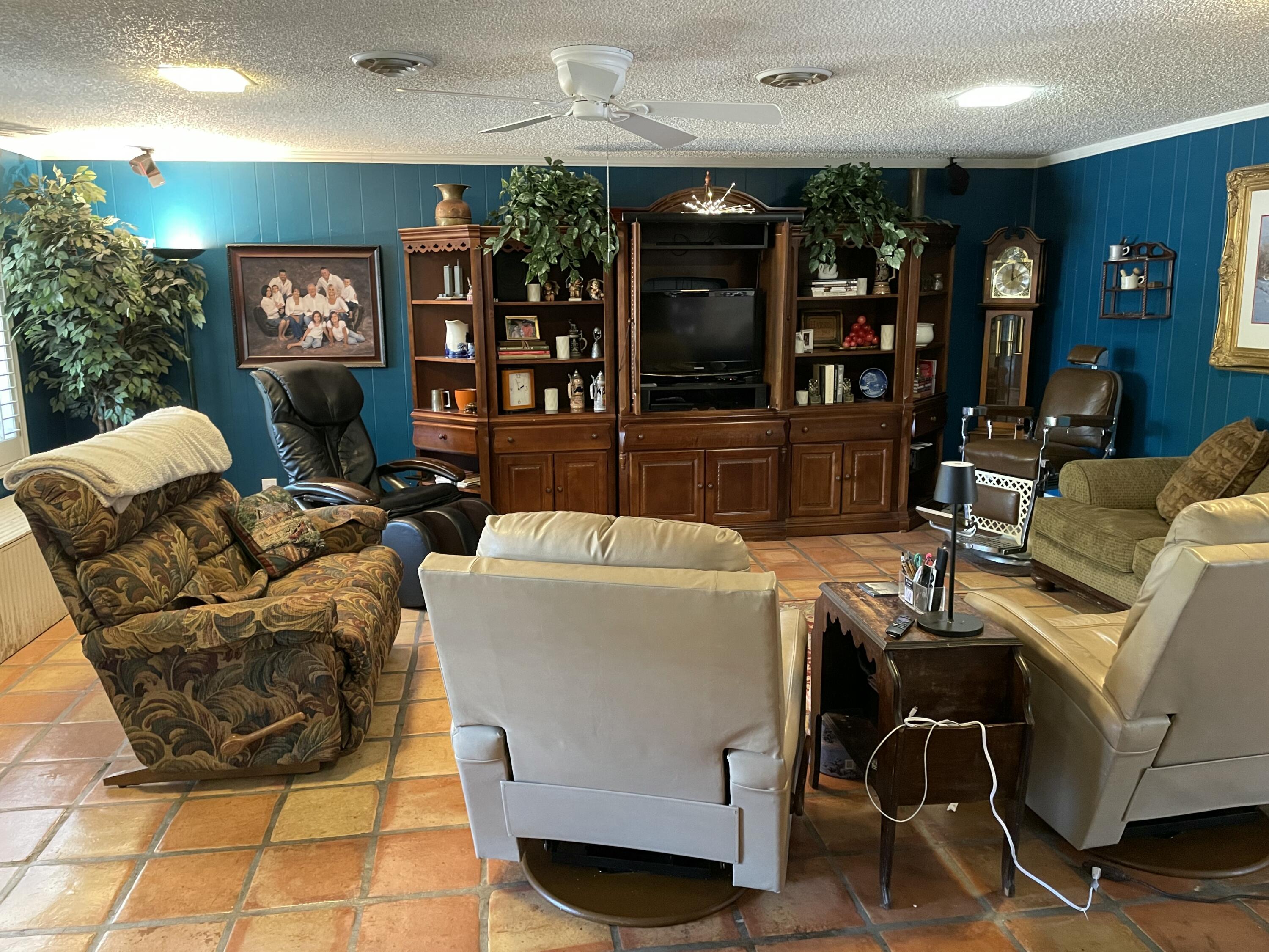 3206 21st Street Lubbock, TX 79410 - Photo 33 of 70 a living room with furniture and a large mirror