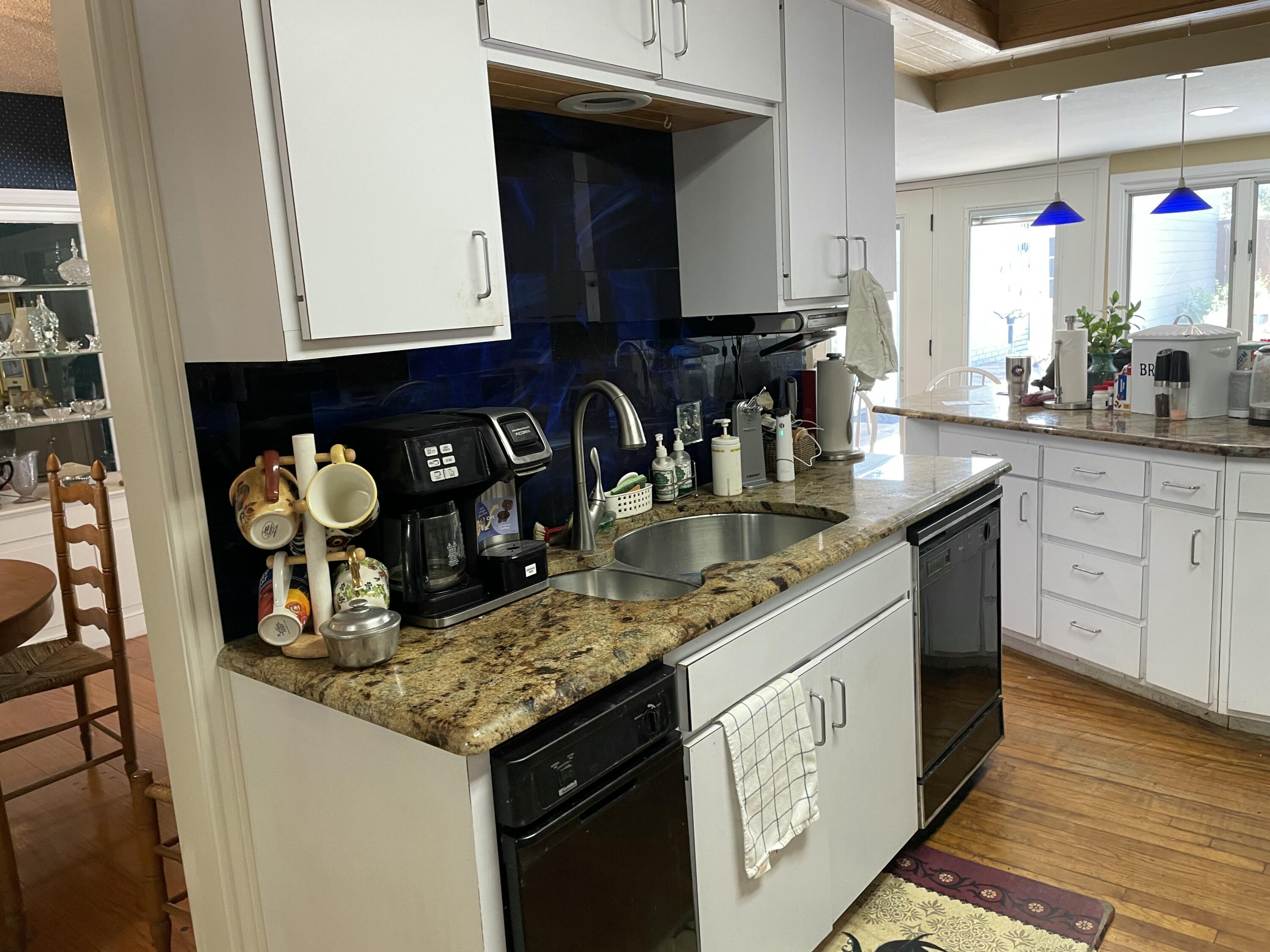 3206 21st Street Lubbock, TX 79410 - Photo 39 of 70 a kitchen with stainless steel appliances granite countertop a sink stove and cabinets