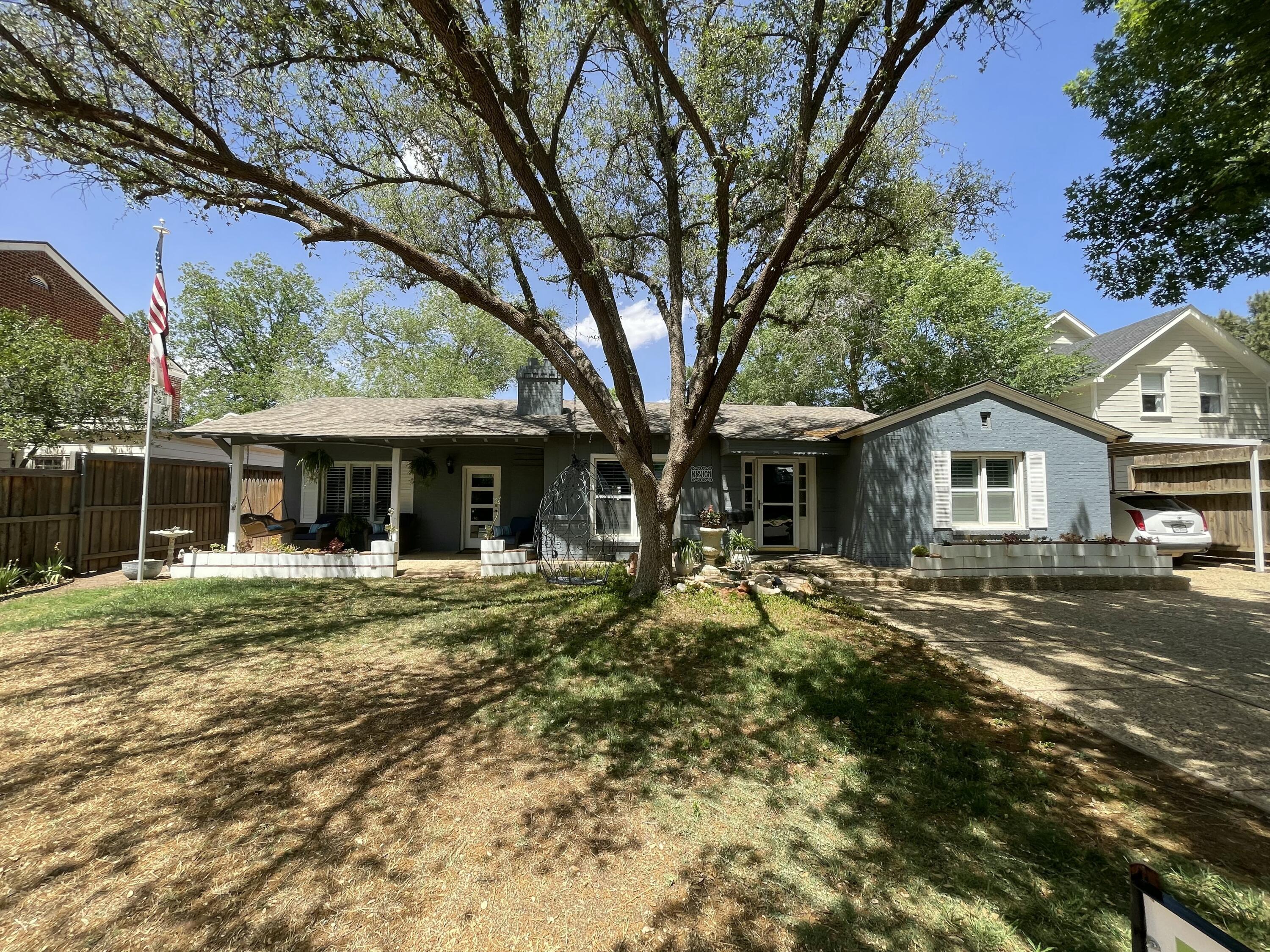 3206 21st Street Lubbock, TX 79410 - Photo 5 of 70 a front view of a house with a yard