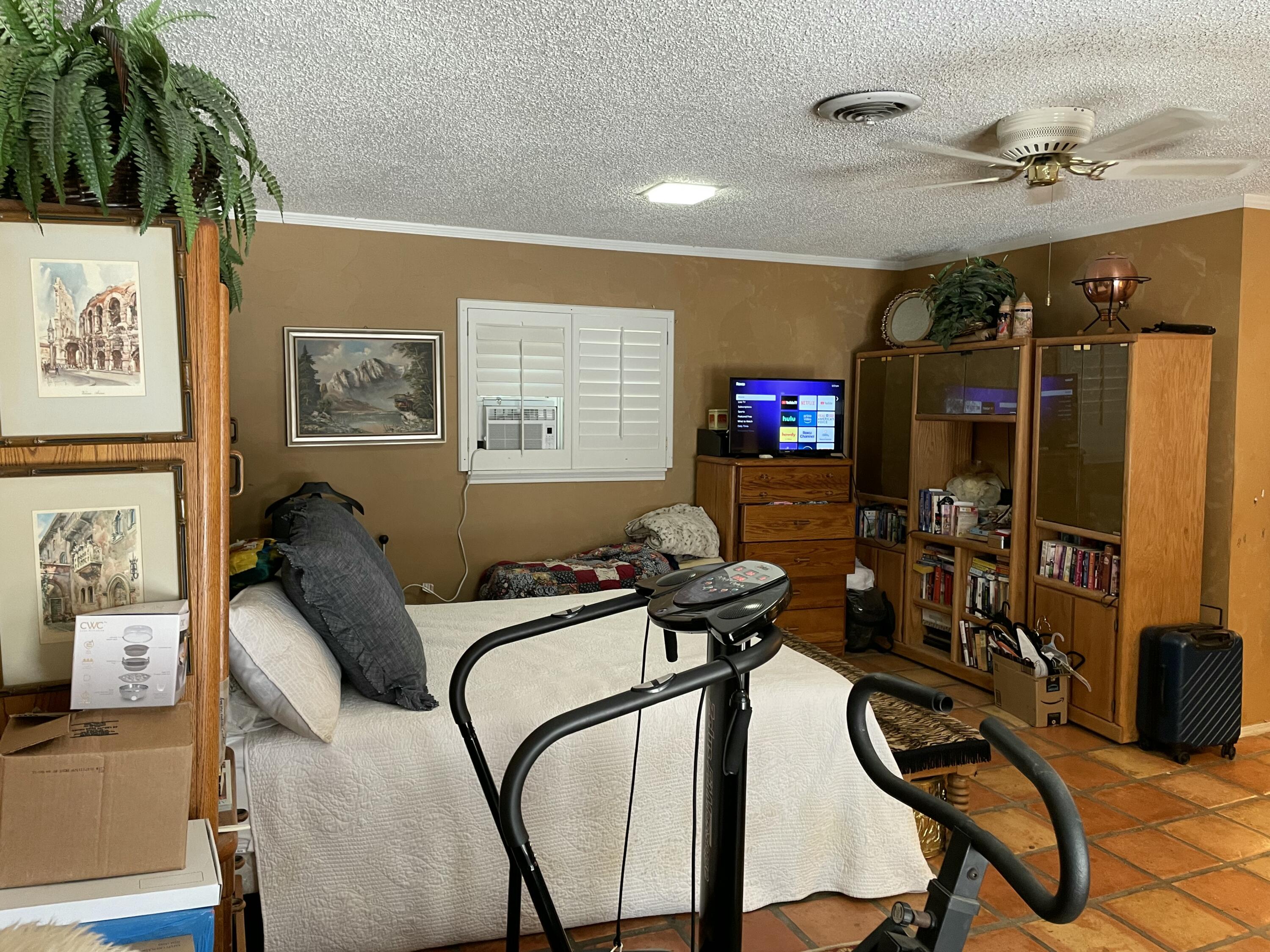 3206 21st Street Lubbock, TX 79410 - Photo 52 of 70 a view of a livingroom with furniture and gym equipment