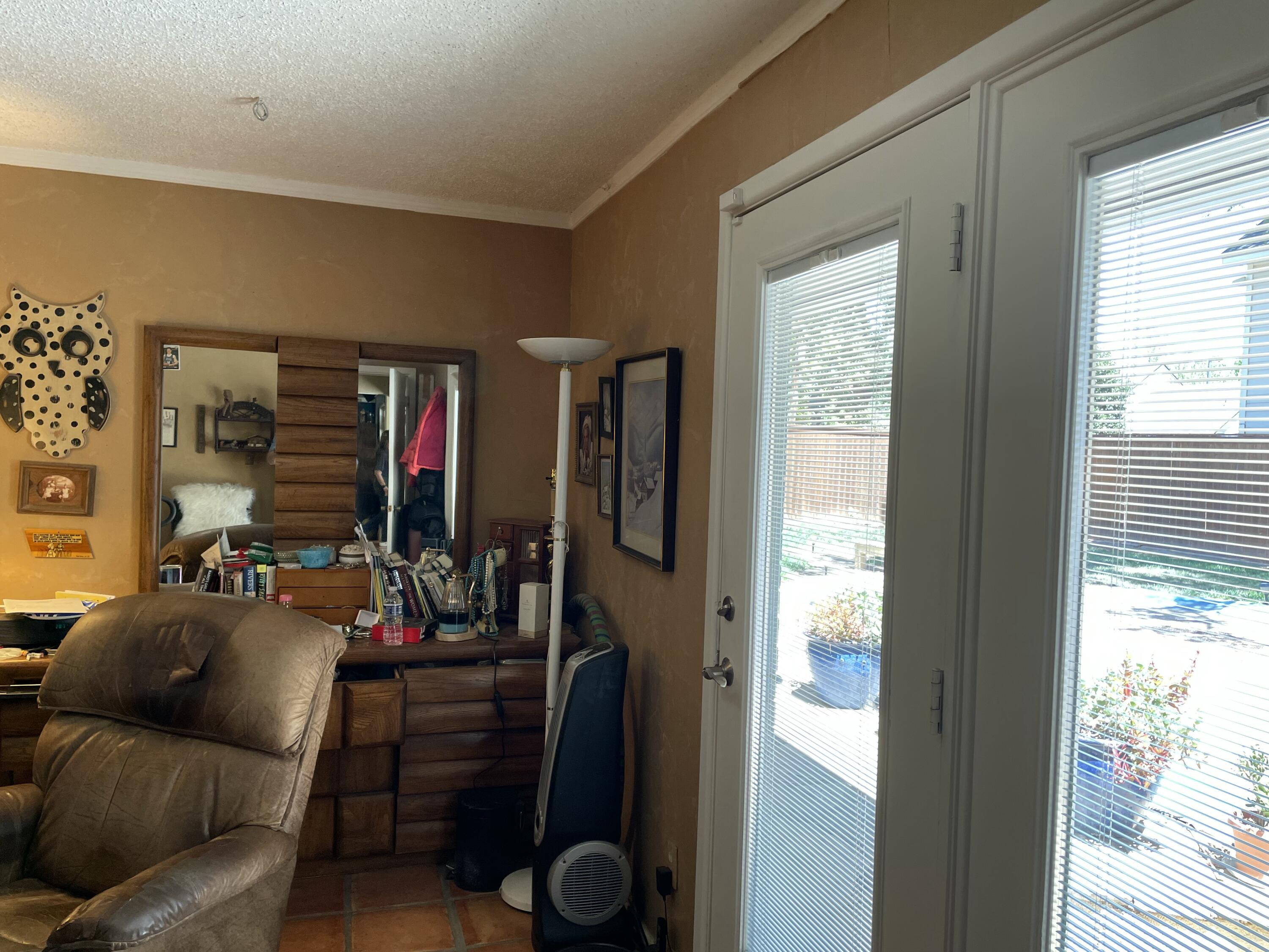 3206 21st Street Lubbock, TX 79410 - Photo 55 of 70 a living room with furniture and a window