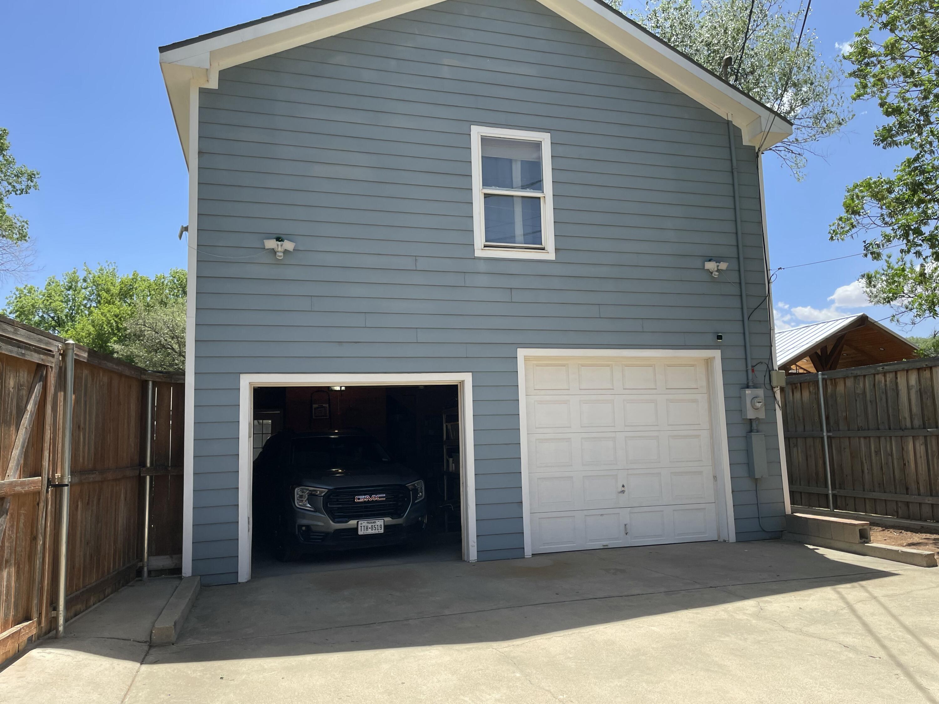 3206 21st Street Lubbock, TX 79410 - Photo 67 of 70 a front view of a house with a garage