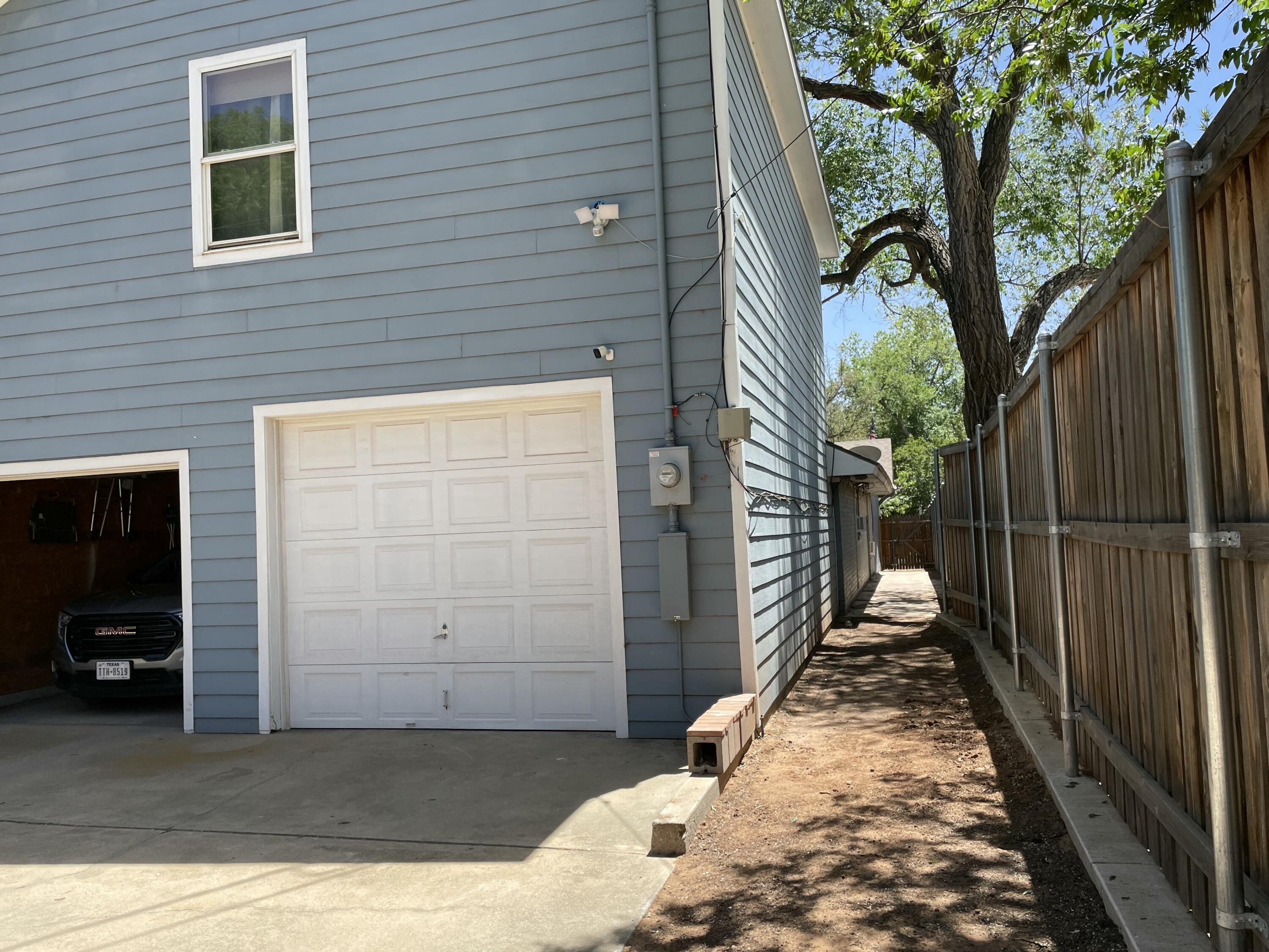 3206 21st Street Lubbock, TX 79410 - Photo 70 of 70 a view of a porch with wooden floor and a large tree