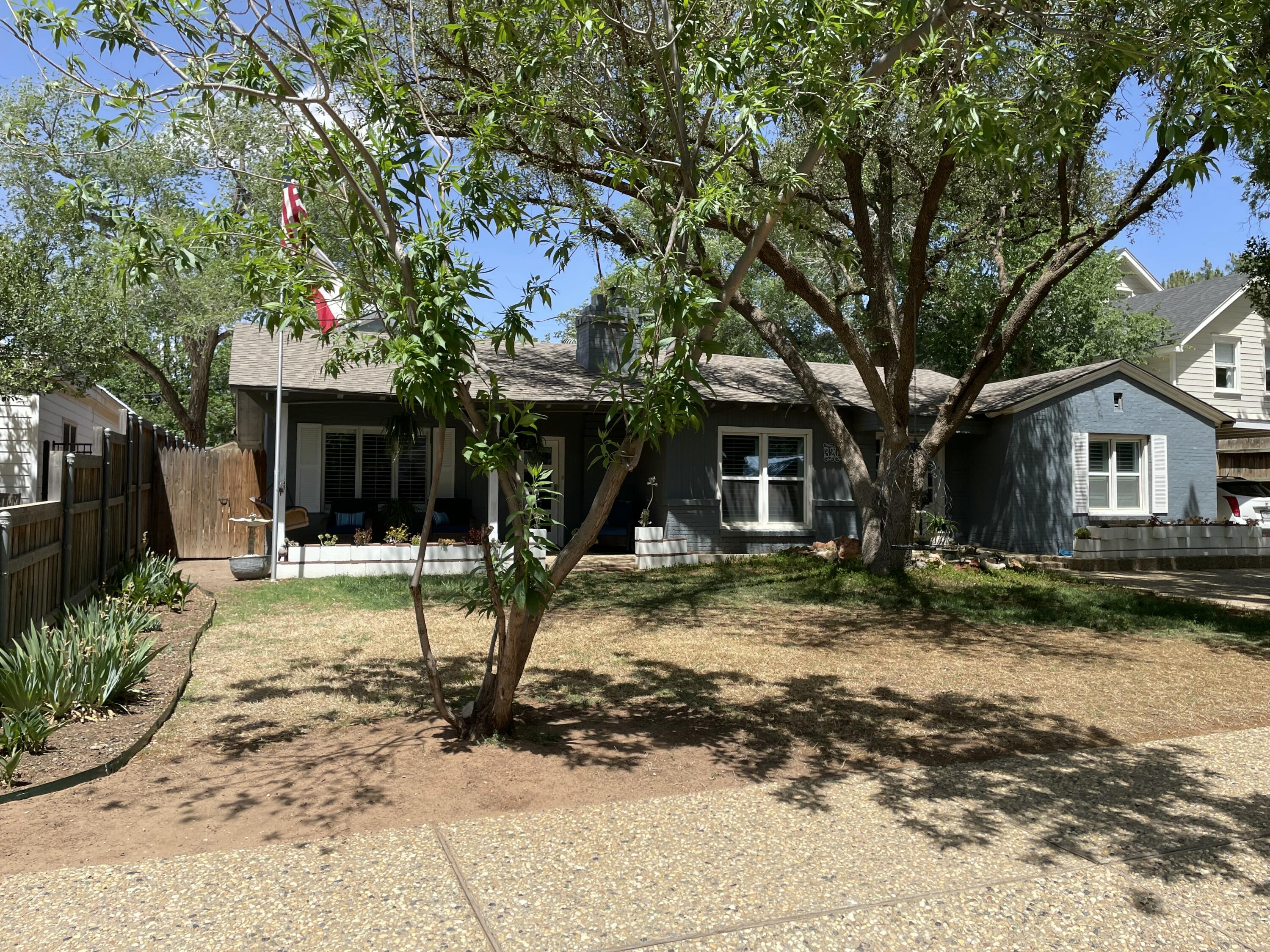 3206 21st Street Lubbock, TX 79410 - Photo 7 of 70 a view of a house with a tree in front of it