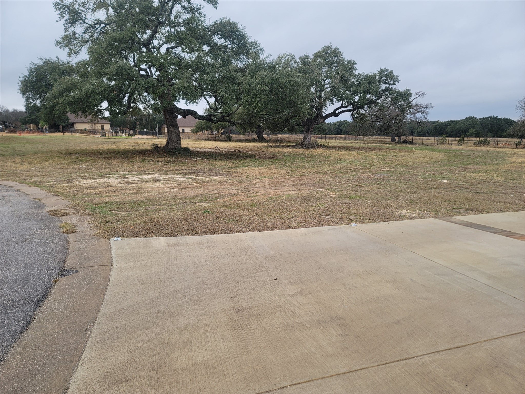 104 Gabgrove Court Georgetown, TX 78633 - Photo 8 of 11 a view of a lake with a yard and trees