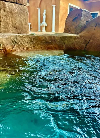 a view of a lake with a nearby house