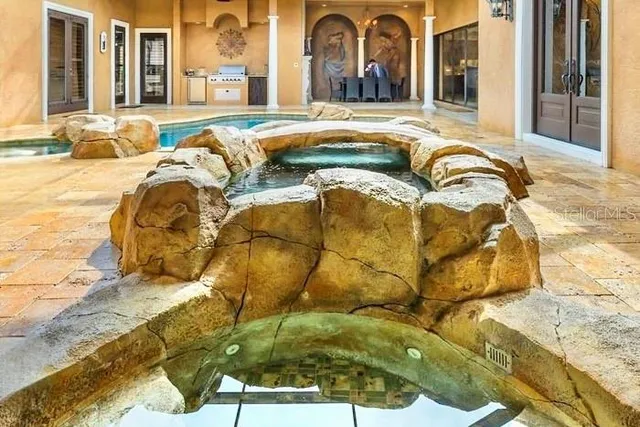 a view of a dining room with furniture and a fireplace