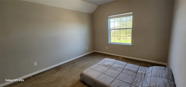 a room with a sink and a mirror