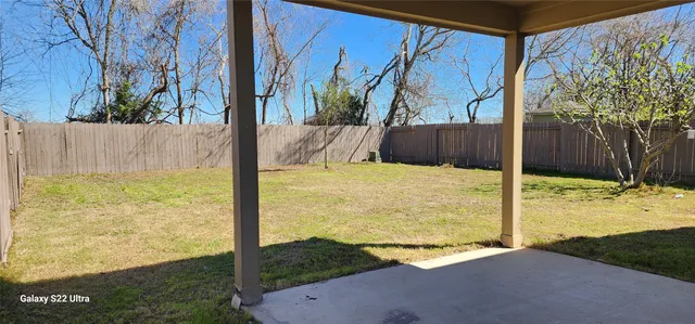 a house view with a backyard space