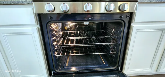 a close view of a fireplace with a wooden floor