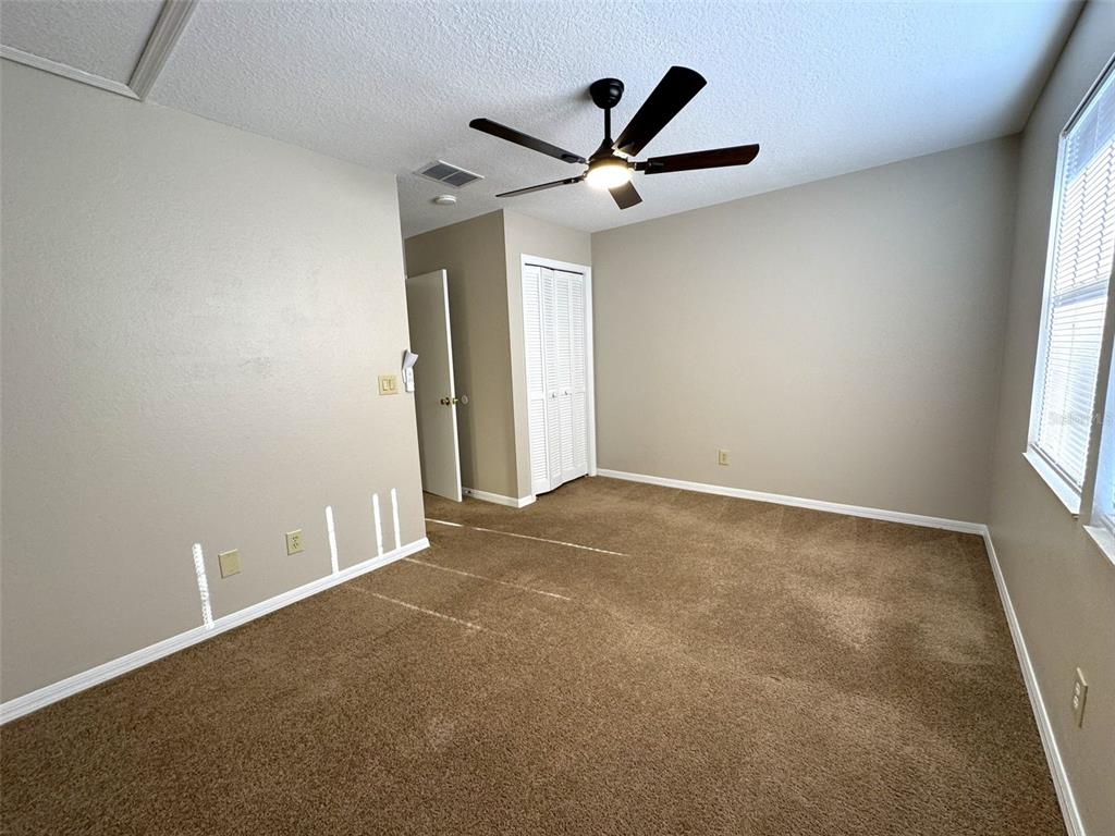 1226 Cypress Cove Court Inverness, FL 34450 - Photo 15 of 25 an empty room with a window and a fan