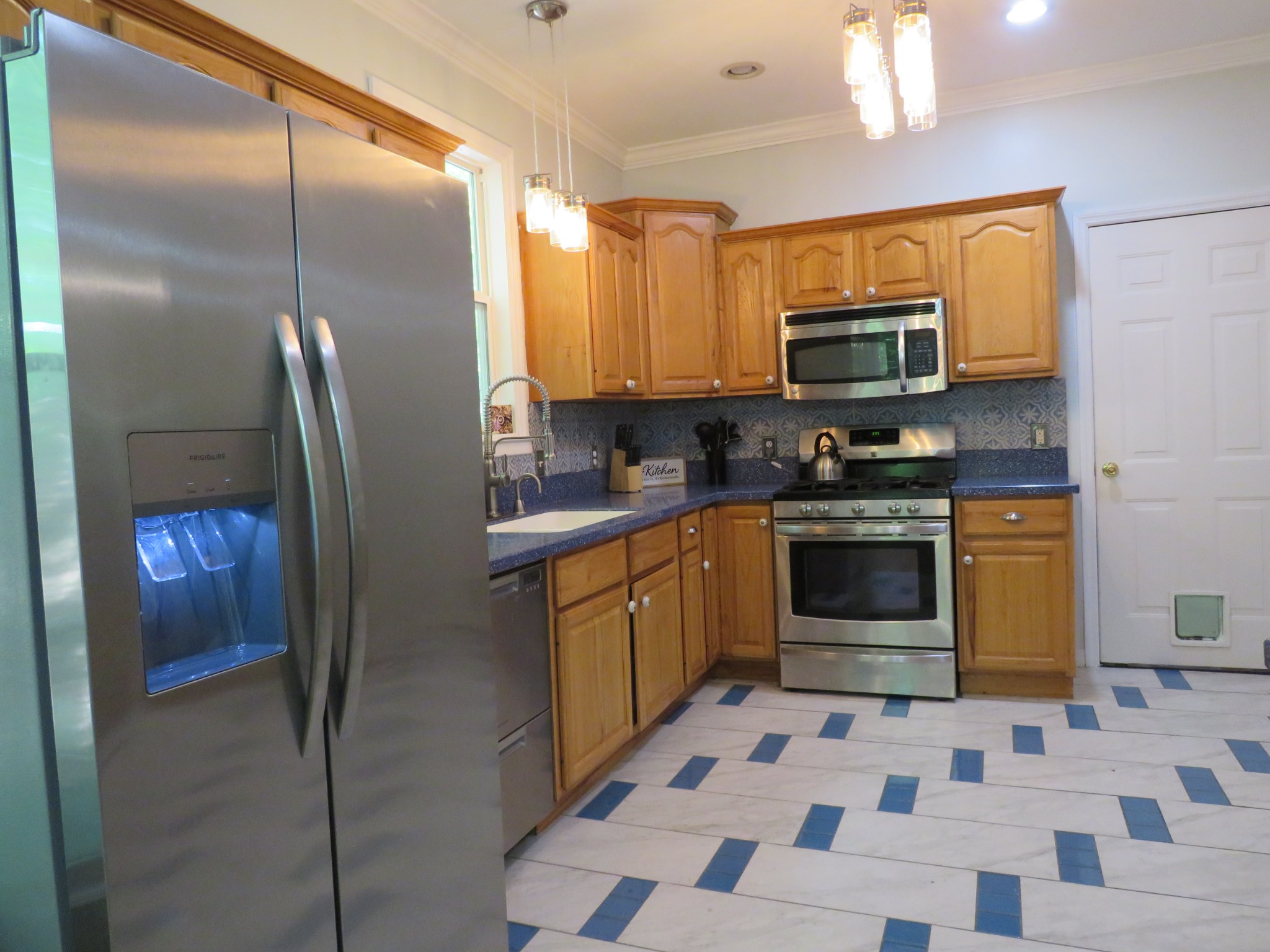 423 Bear Court Monteagle, TN 37356 - Photo 12 of 34 a kitchen with stainless steel appliances granite countertop a refrigerator a stove top oven and sink
