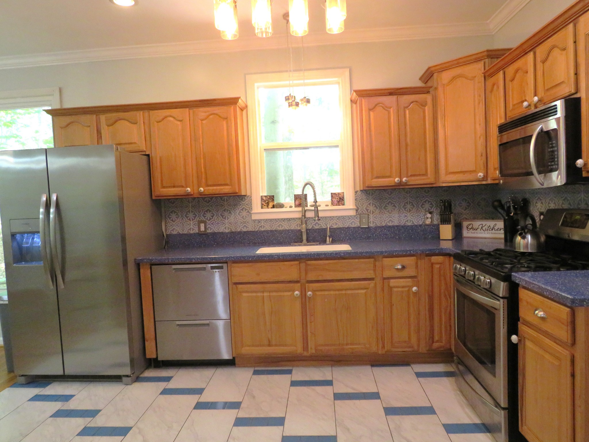 423 Bear Court Monteagle, TN 37356 - Photo 13 of 34 a kitchen with stainless steel appliances granite countertop a refrigerator sink and cabinets