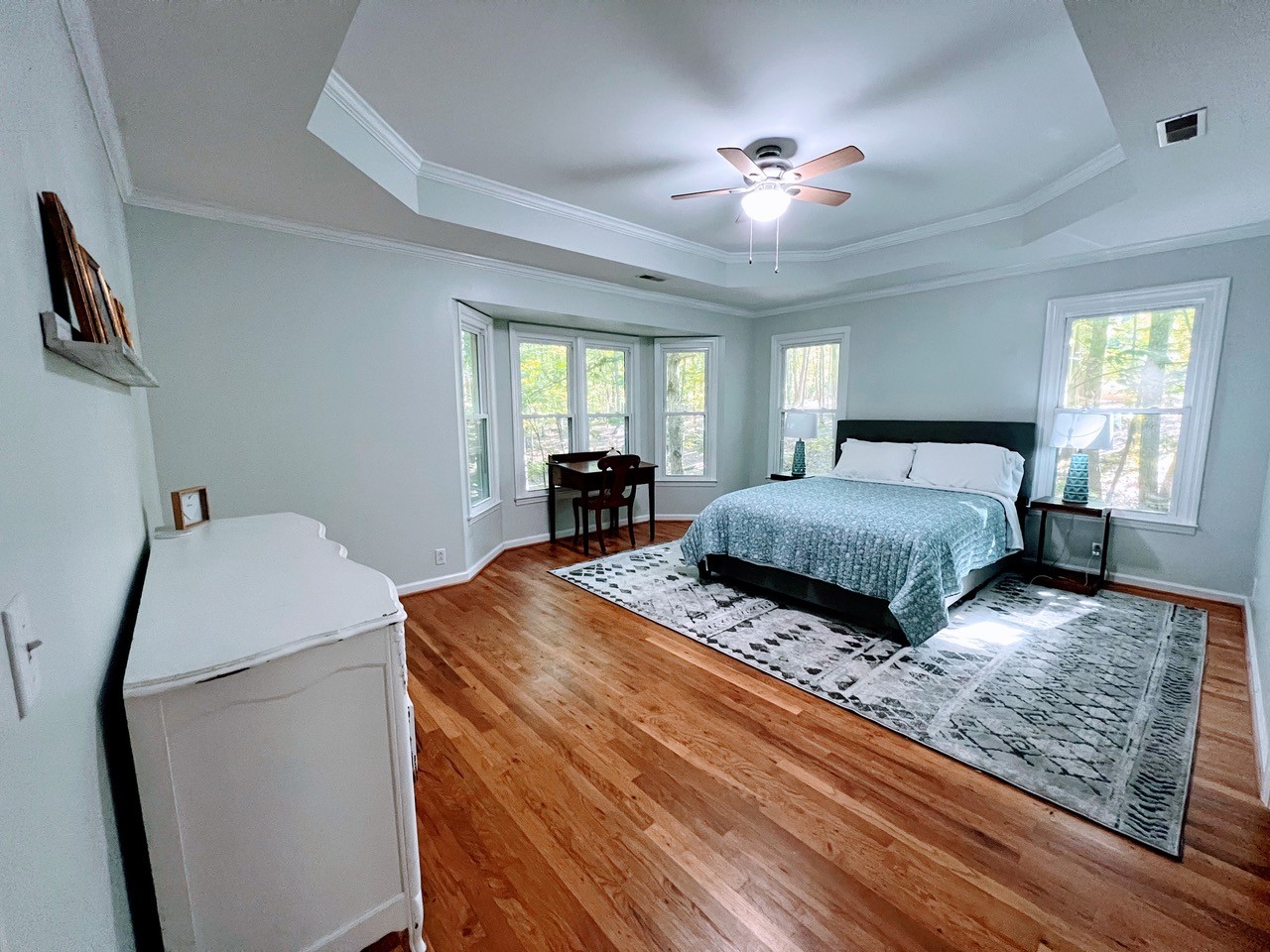 423 Bear Court Monteagle, TN 37356 - Photo 18 of 34 a bedroom with double bed and a chandelier