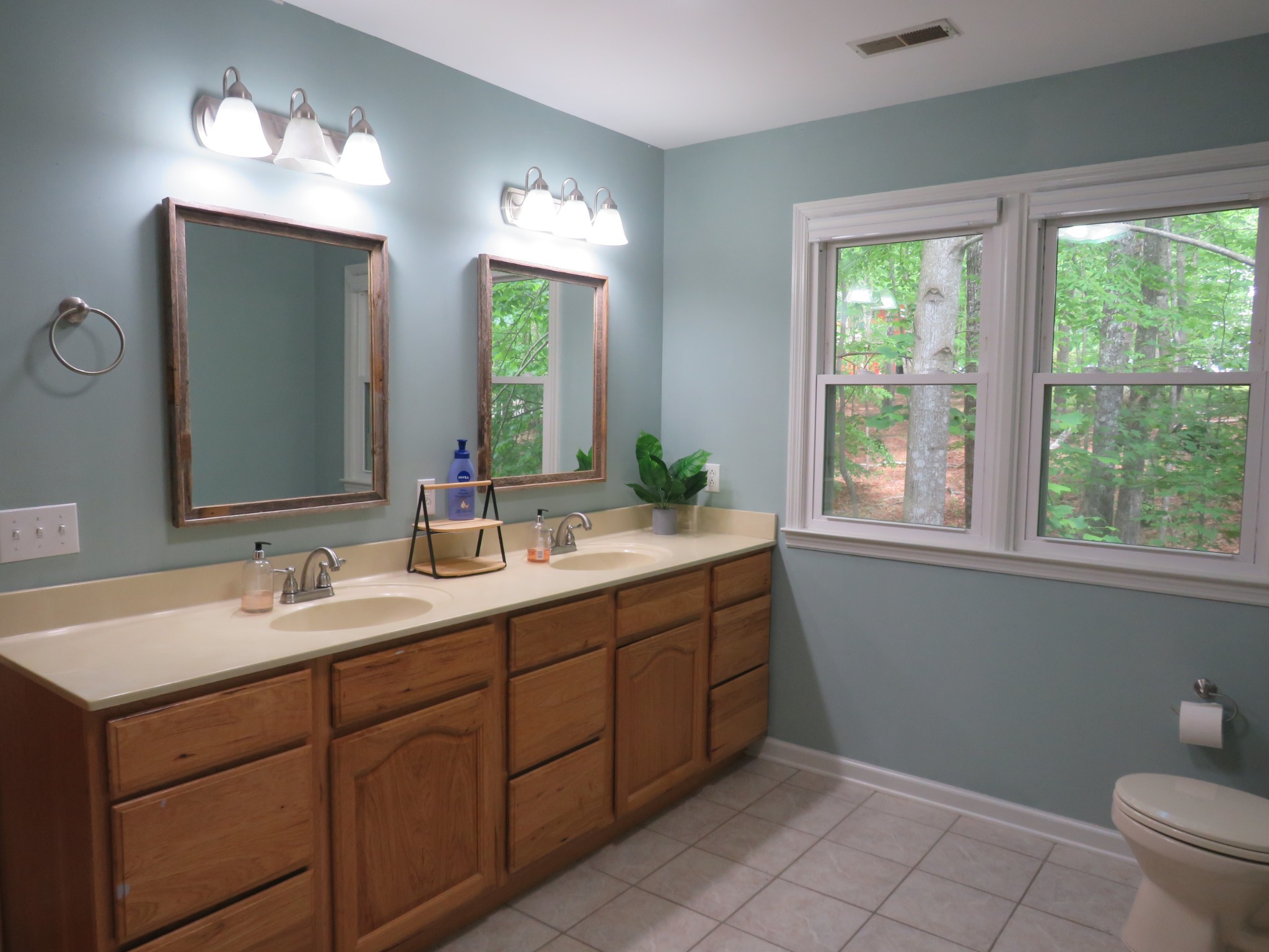 423 Bear Court Monteagle, TN 37356 - Photo 21 of 34 a bathroom with a double vanity sink toilet and a mirror