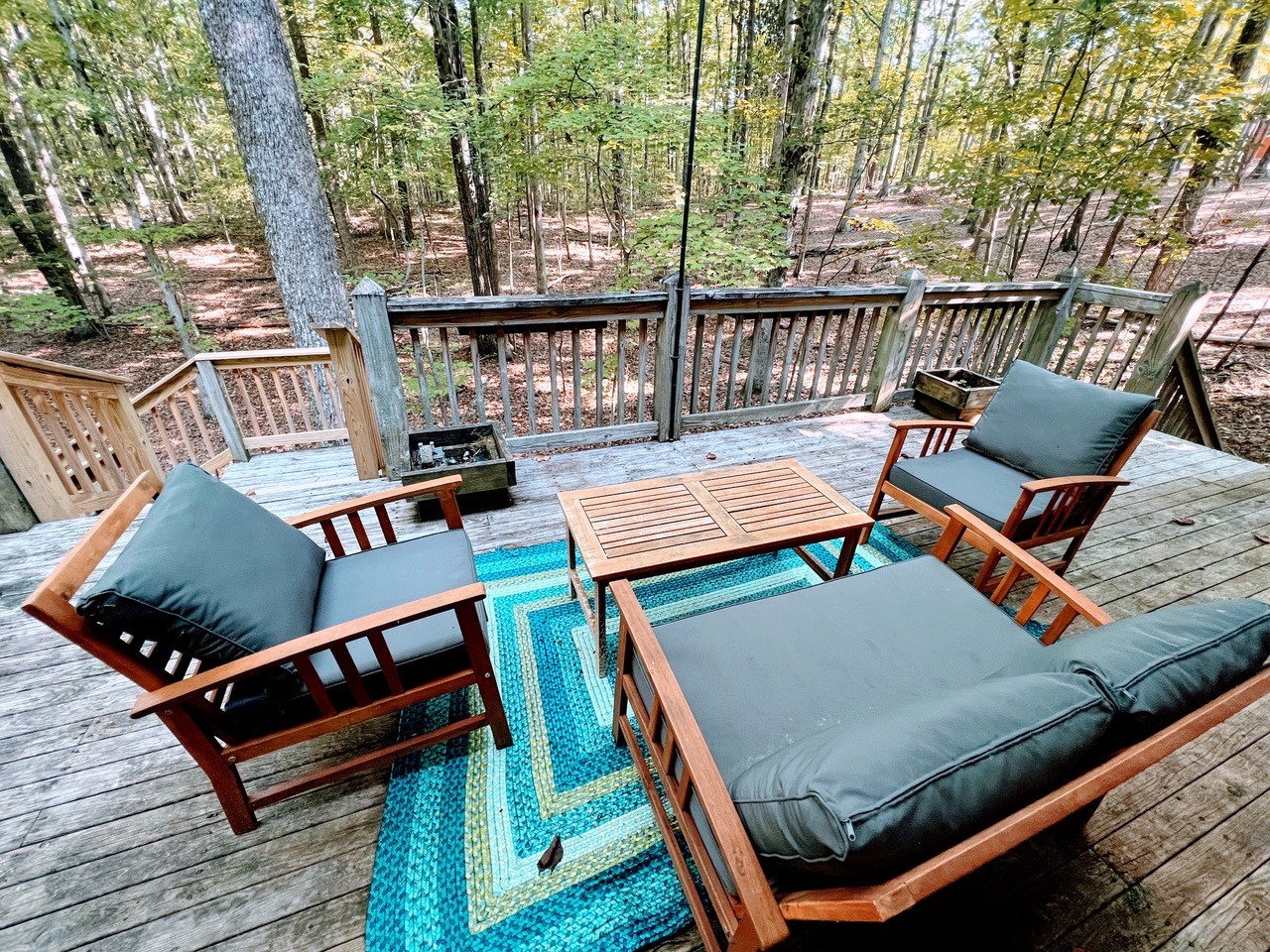 423 Bear Court Monteagle, TN 37356 - Photo 30 of 34 a view of a roof deck with wooden floor and outdoor seating