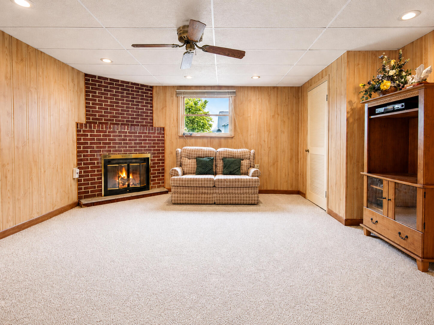 9502 Forrest Drive Highland, IN 46322 - Photo 17 of 27 a view of an empty room with a fireplace and a window