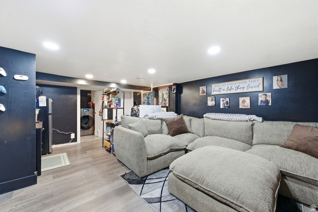 2323 North 720 West Clinton, UT 84015 - Photo 12 of 34 Home theater room with light wood-type flooring, washer / clothes dryer, and recessed lighting