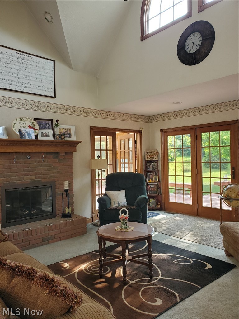 8507 Crum Road Southeast Sherrodsville, OH 44675 - Photo 3 of 30 Great room with fireplace, vaulted ceilings and french doors to back deck.