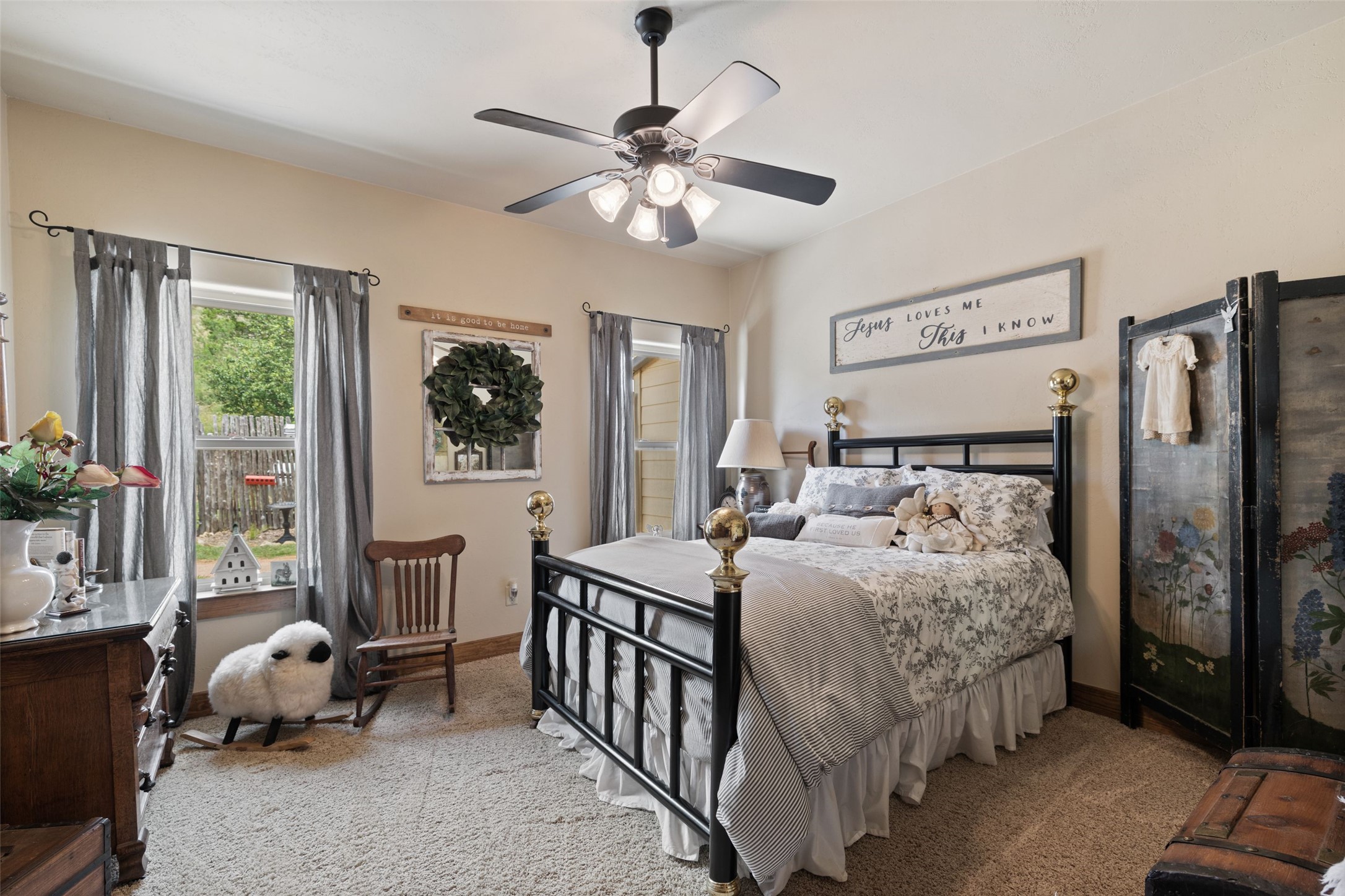 8400 Ranch Road 1431 Marble Falls, TX 78654 - Photo 28 of 30 Cozy bedroom with ample natural light, featuring a modern ceiling fan and plush carpeting.