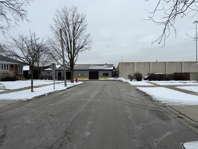 a view of street with a yard covered with snow