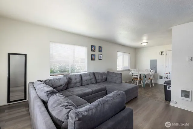 a living room with furniture and a large window