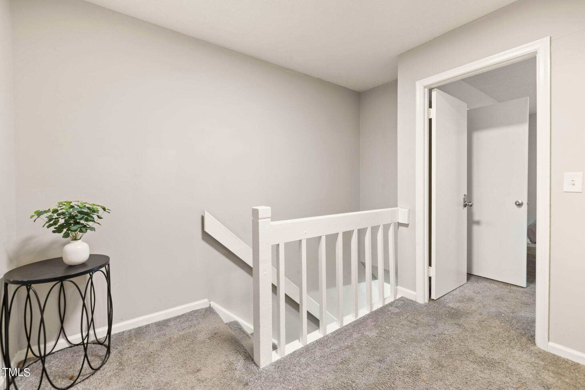 5955 Dixon Drive Raleigh, NC 27609 - Photo 12 of 26 a view of entryway with wooden floor