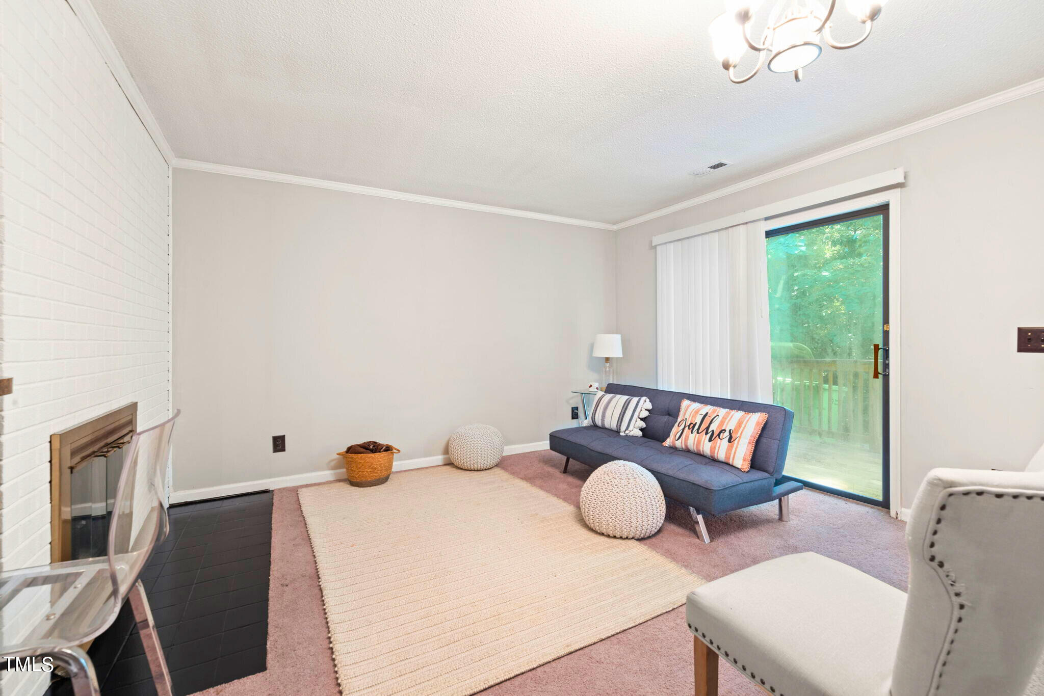 5955 Dixon Drive Raleigh, NC 27609 - Photo 19 of 26 a living room with furniture and a large window