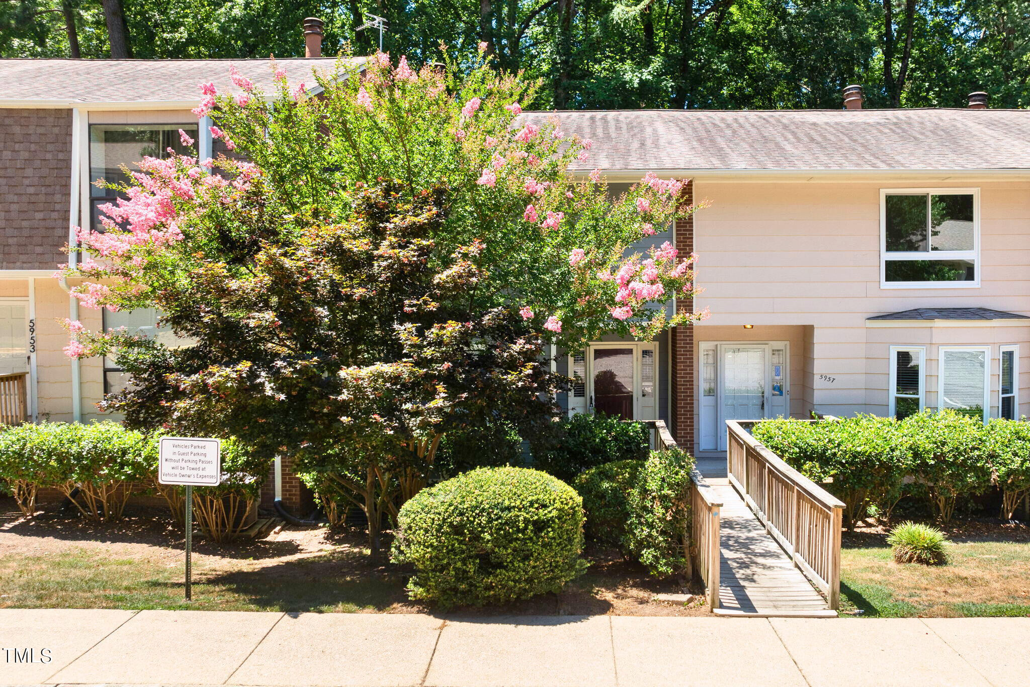 5955 Dixon Drive Raleigh, NC 27609 - Photo 2 of 26 a front view of a house with a yard