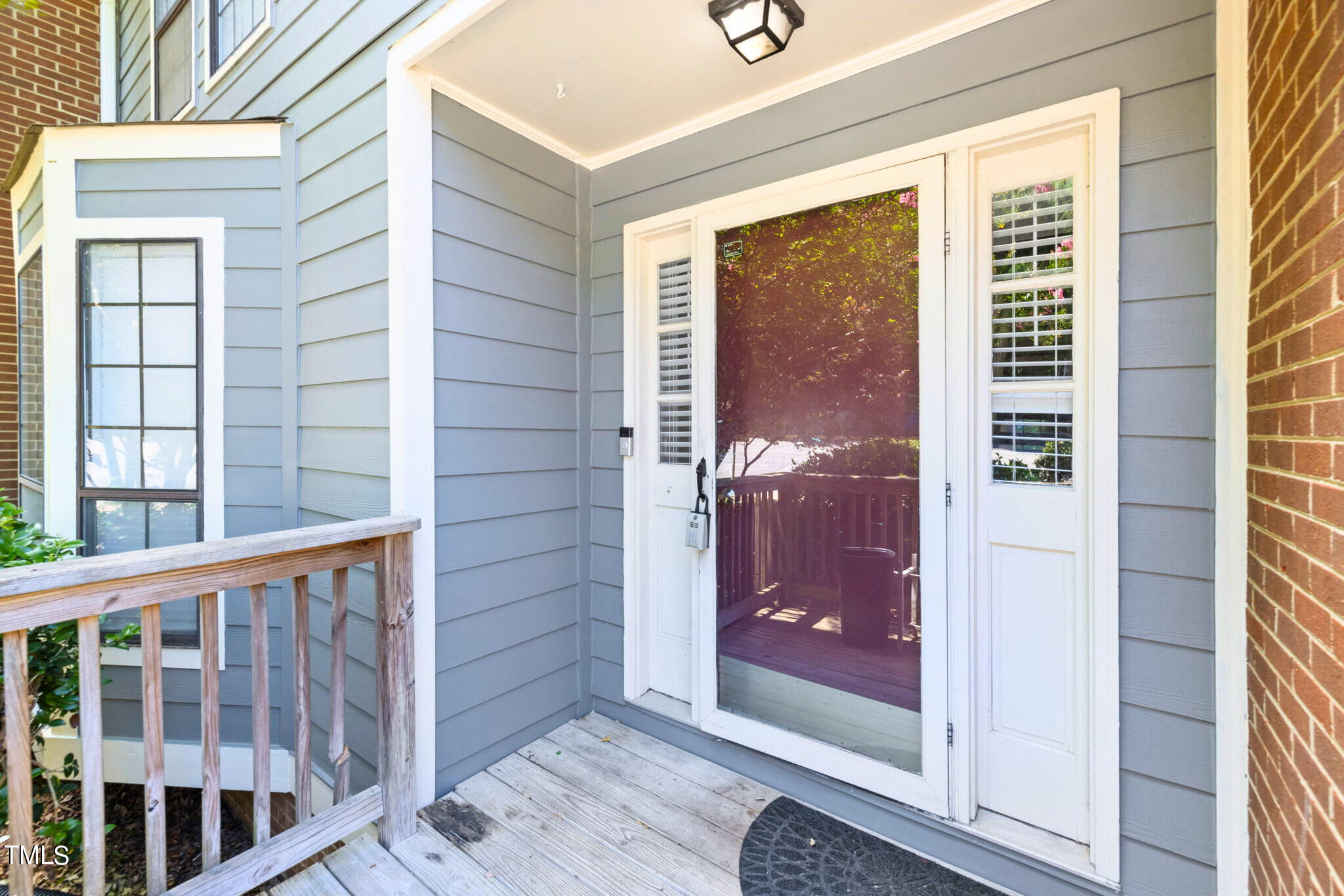5955 Dixon Drive Raleigh, NC 27609 - Photo 3 of 26 a view of a porch of a house