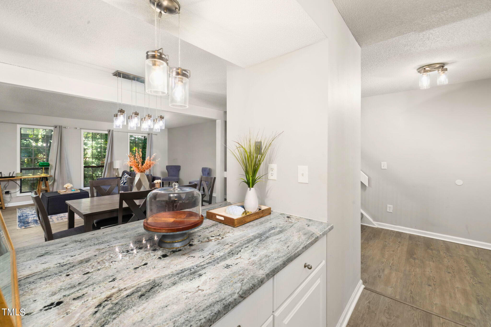 5955 Dixon Drive Raleigh, NC 27609 - Photo 6 of 26 a view of a living room and dining room