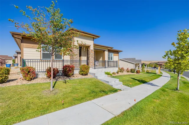 a view of a house with backyard porch and sitting area