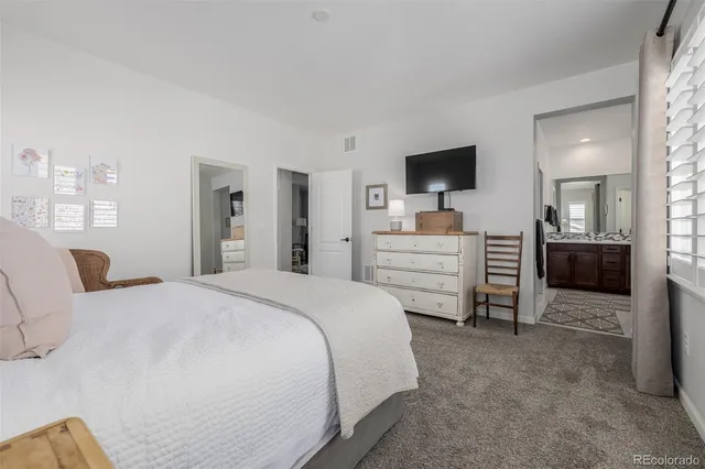 a bedroom with a bed and furniture