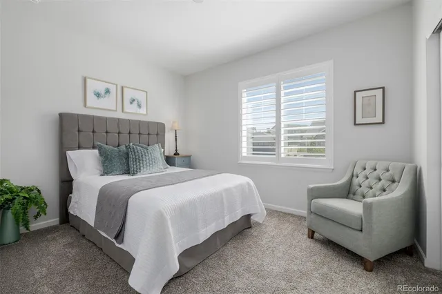 a bed room with a bed and a couch