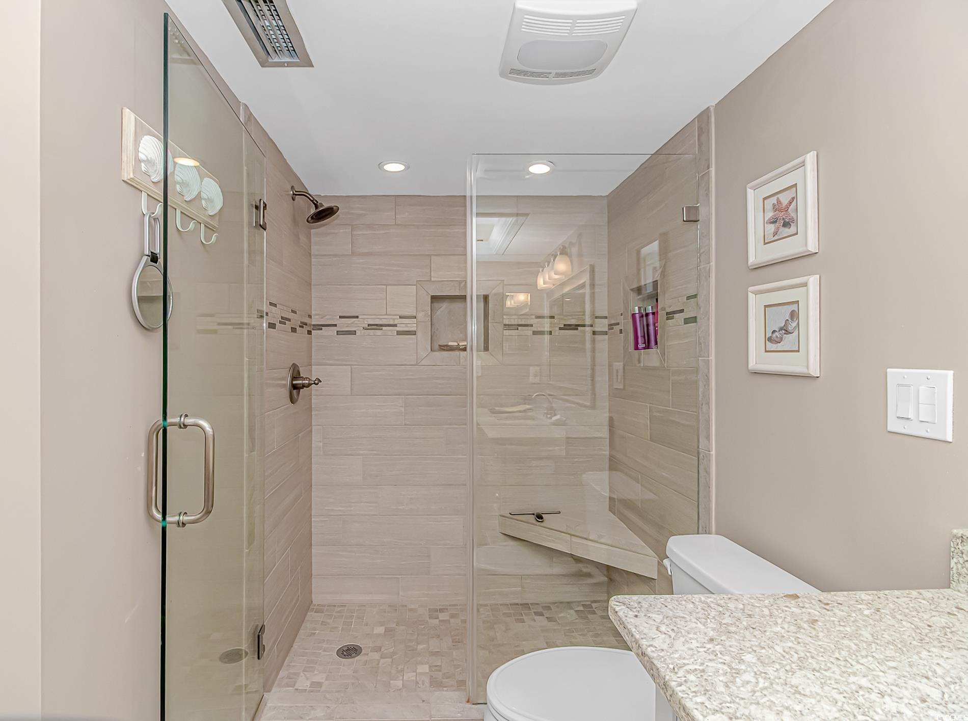 10100 Beach Club Drive, Unit 2B Myrtle Beach, SC 29572 - Photo 19 of 30 Full bathroom featuring vanity, a stall shower, and recessed lighting