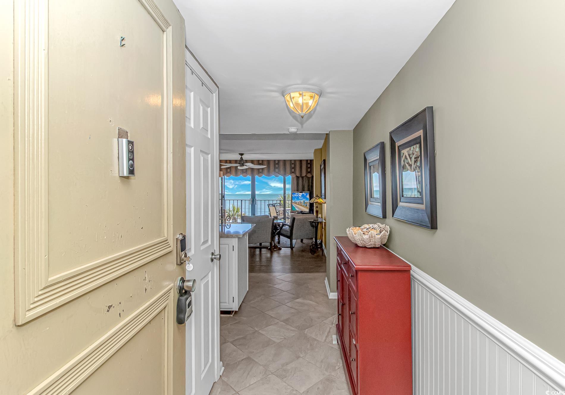 10100 Beach Club Drive, Unit 2B Myrtle Beach, SC 29572 - Photo 2 of 30 Hallway featuring light tile patterned floors