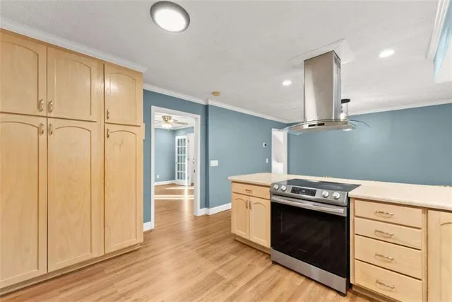a kitchen with a stove and a refrigerator