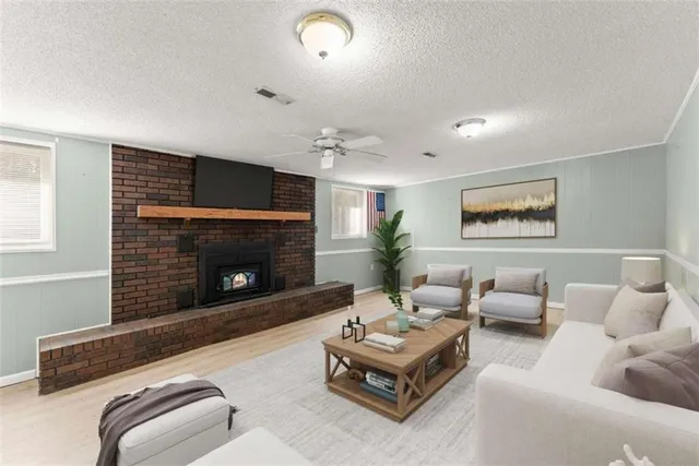 a living room with furniture and a fireplace