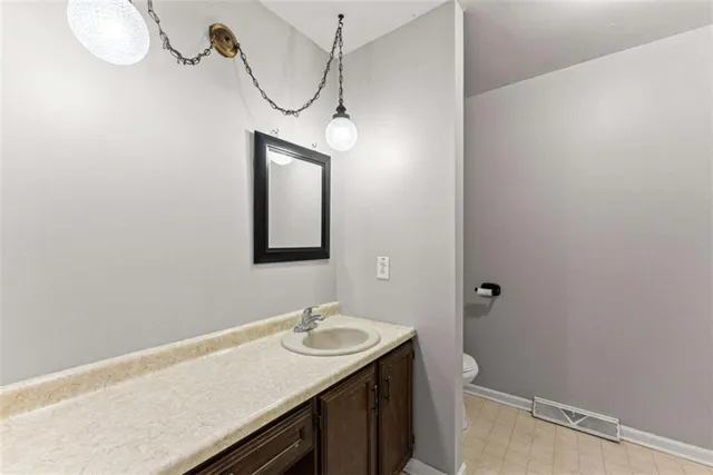a bathroom with a sink and mirror