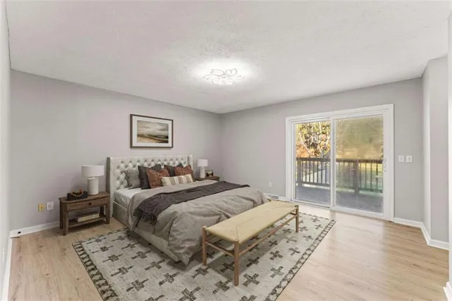 a bedroom with a large bed and a tv