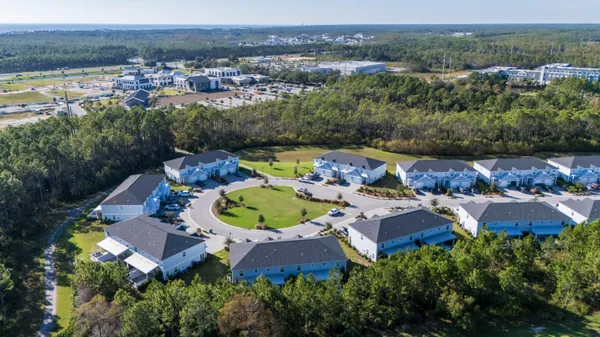 an aerial view of residential house with outdoor space and swimming pool