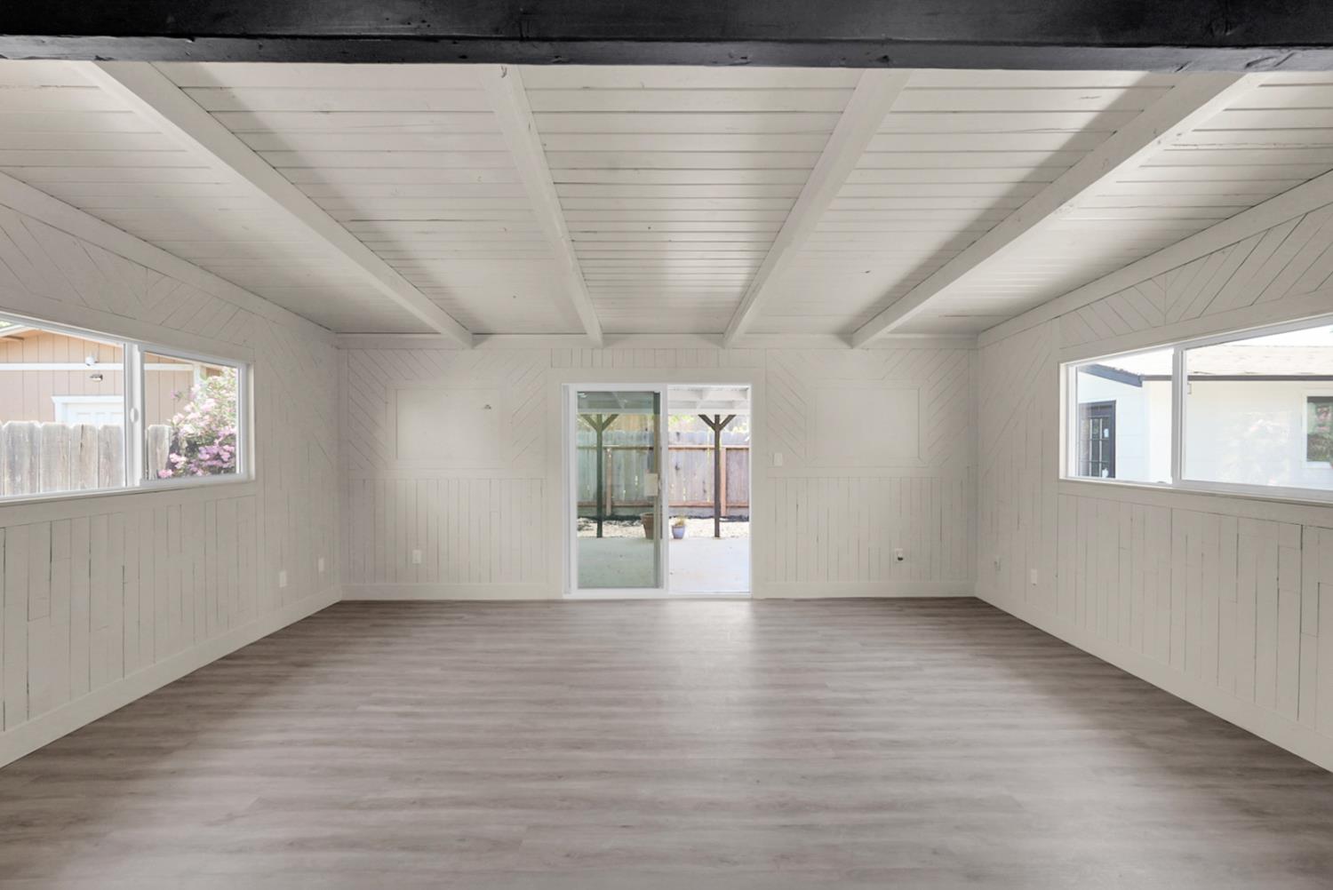 2832 Fowler Road Ceres, CA 95307 - Photo 7 of 28 a view of empty room with wooden floor and fan