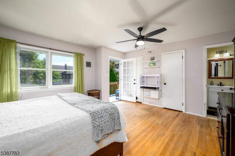 920 Robin Road Hillsborough, NJ 08844 - Photo 13 of 29 a spacious bedroom with a large bed and a large window