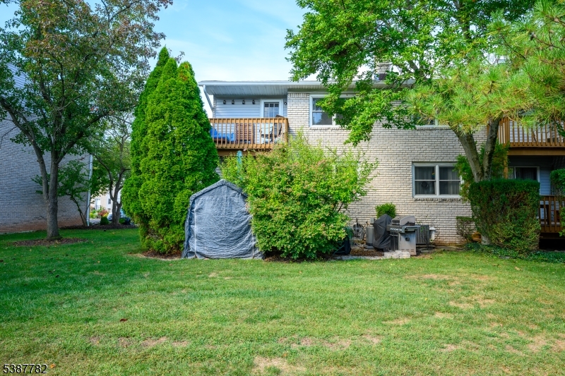920 Robin Road Hillsborough, NJ 08844 - Photo 25 of 29 a front view of a house with a garden and yard