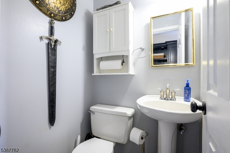 920 Robin Road Hillsborough, NJ 08844 - Photo 4 of 29 a bathroom with a toilet a sink and mirror