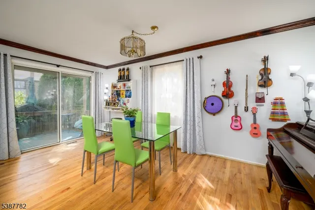 a view of a room with furniture and wooden floor