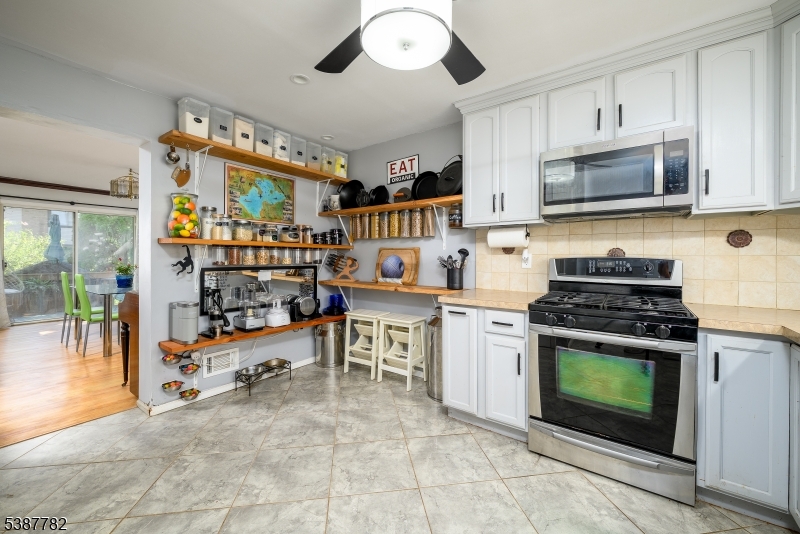 920 Robin Road Hillsborough, NJ 08844 - Photo 8 of 29 a kitchen with stainless steel appliances granite countertop a stove and a sink