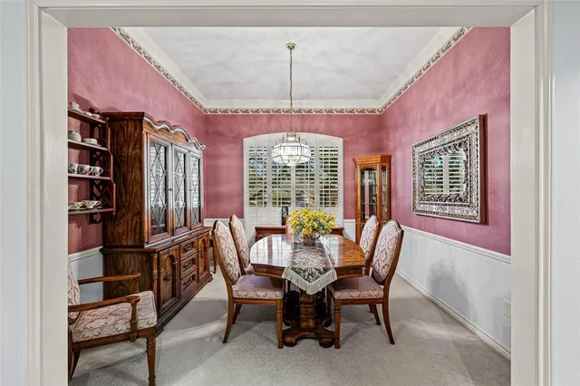 a kitchen with white cabinets and appliances