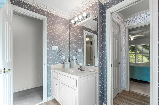 a living room with furniture a flat screen tv and a floor to ceiling window